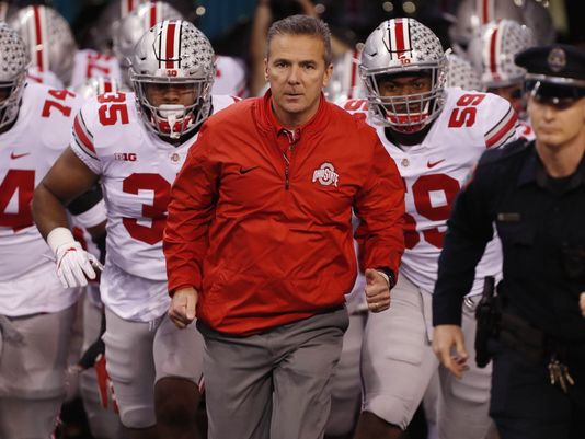 Urban Meyer (Middle) and fellow Ohio State Players (Left and Right)