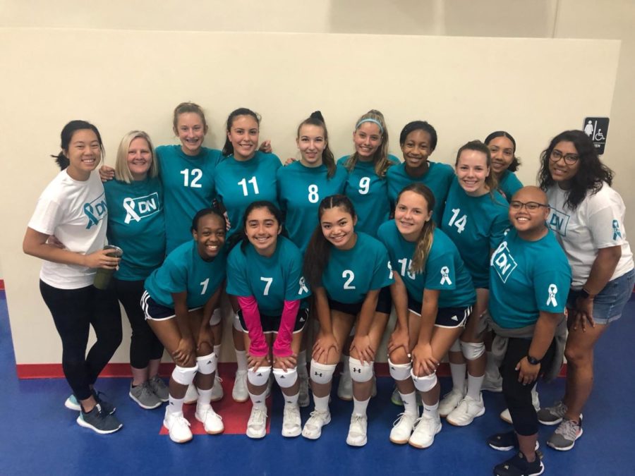 ERHS Girl's Volleyball team in uniform with their coaches