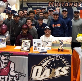 Baseball team at signing day.