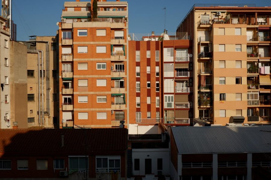 On our first day in Barcelona, the sunrise lights up the city, apartment buildings across from ours illuminated with the morning.