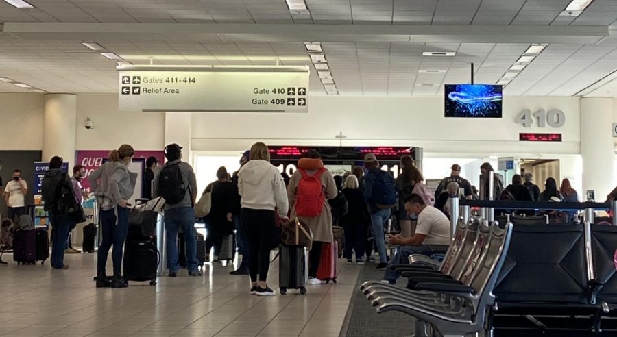 Passengers waiting to board a flight at Ontario Airport.