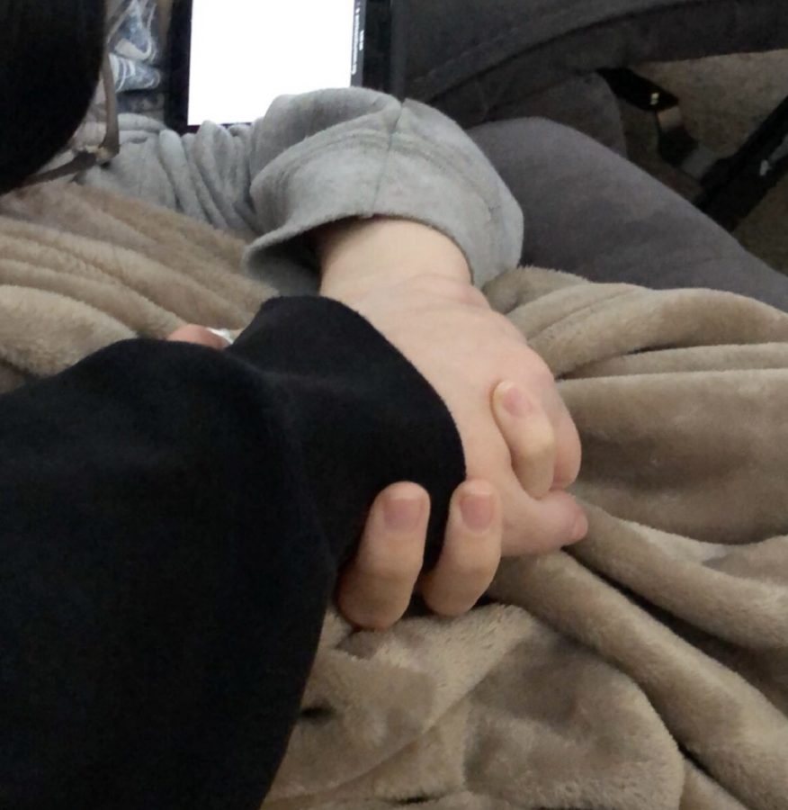 My friend and I holding hands on a lazy Sunday morning. 