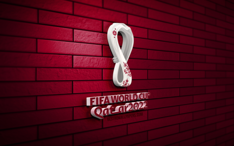 A wall decorated with the 2022 FIFA World Cup colors and symbol. 
