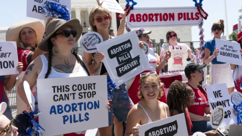 Protesters outside the US Supreme Court in 2022 at an abortion pills educational booth. Credit to Jose Luis Magana, AP.