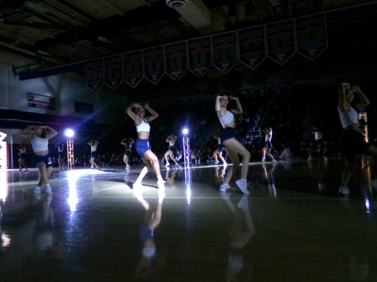 Song dances during the pep rally