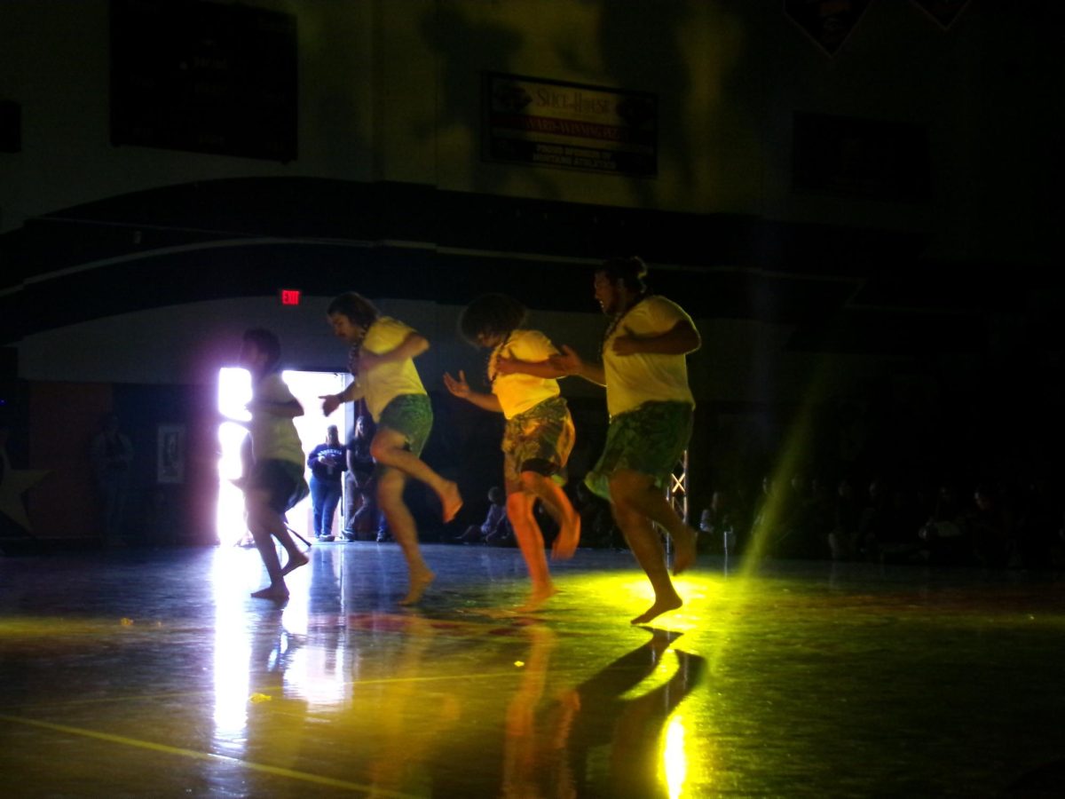 Poly Club members performing for the fall rally.