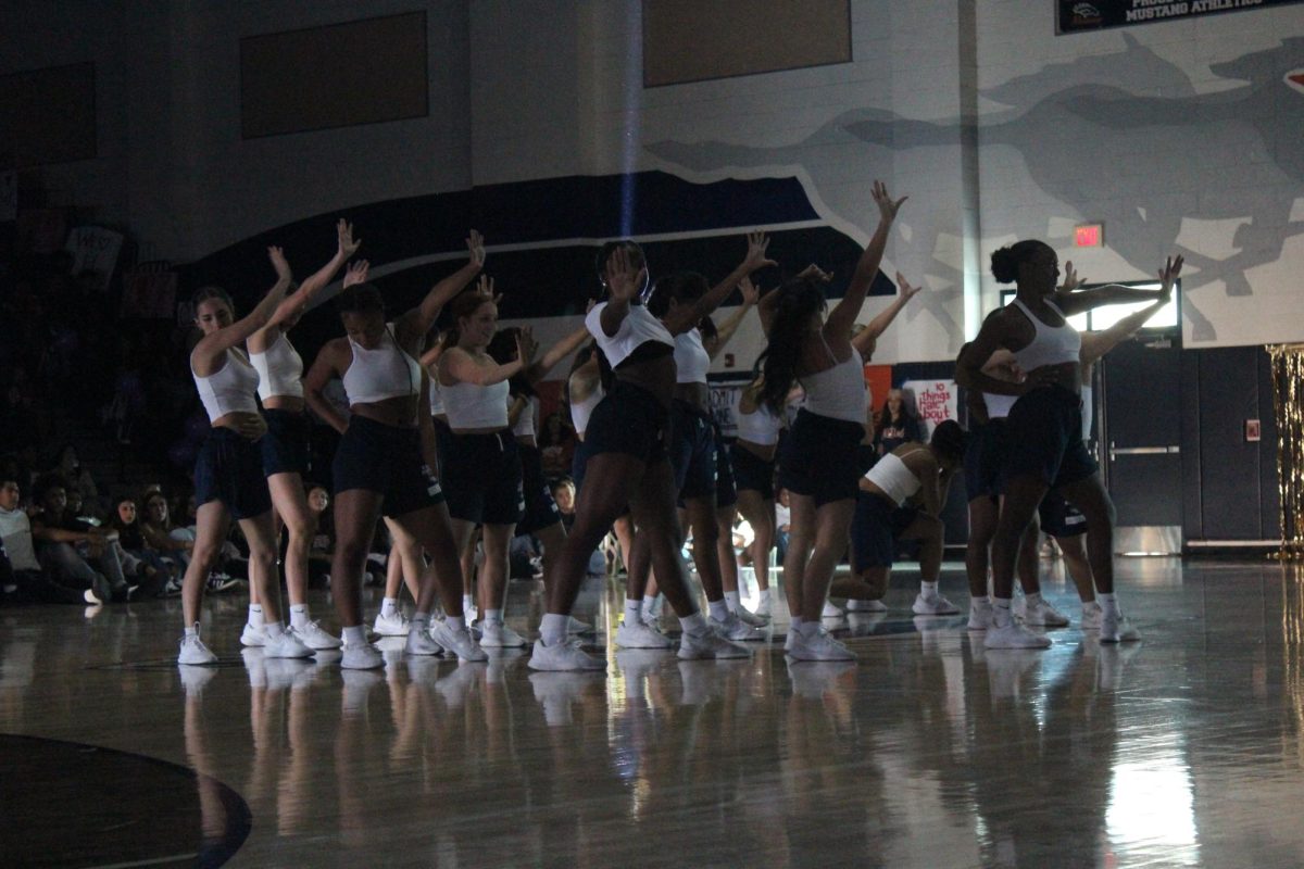 Song performing their dance routine for the pep rally