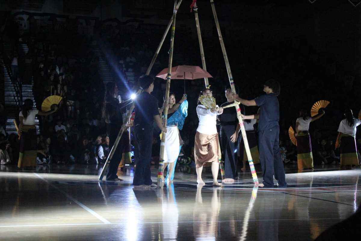 AFA performing with fans and umbrellas during the pep rally