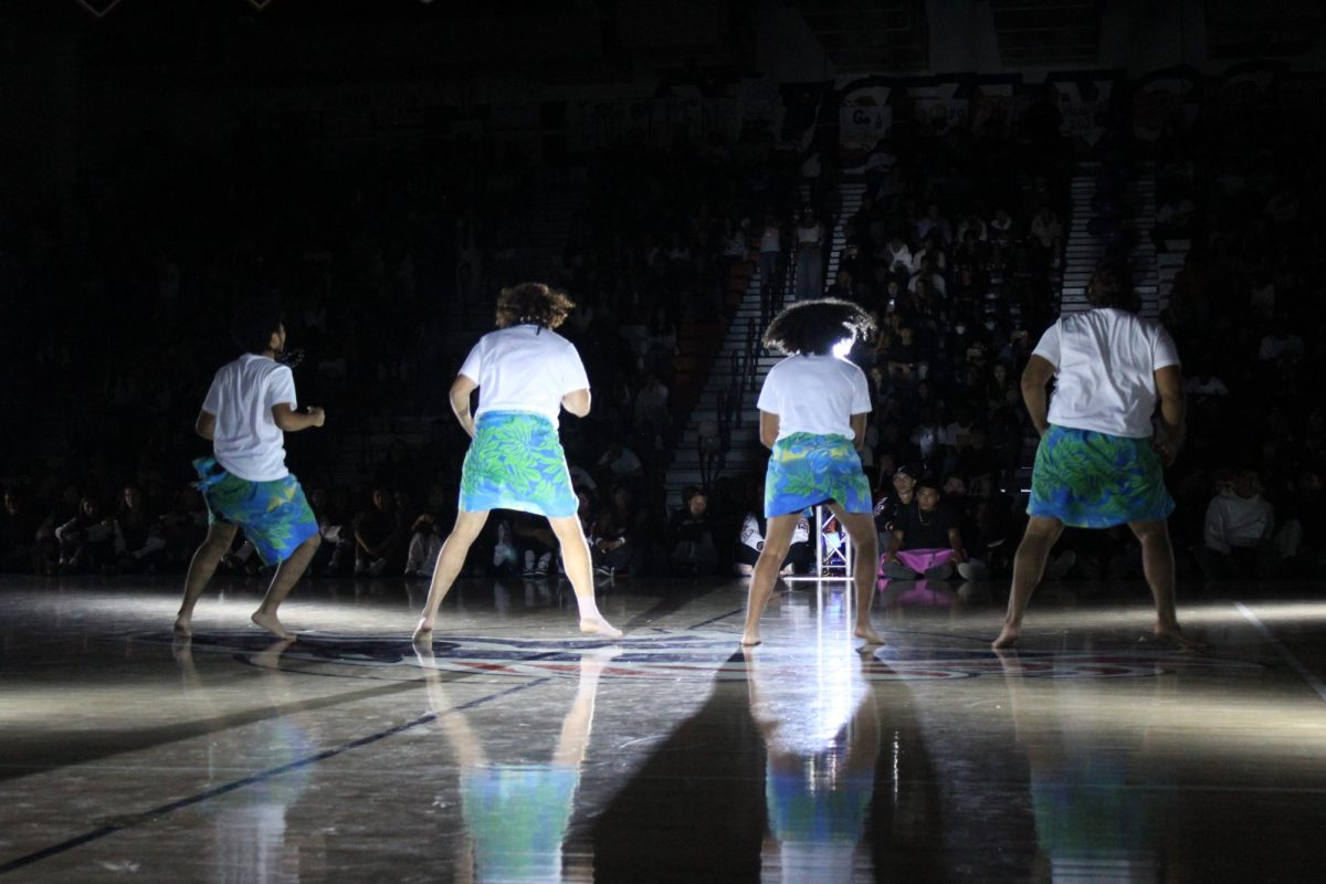 Polynesian Club's boys performing their Haka dance for the pep rally