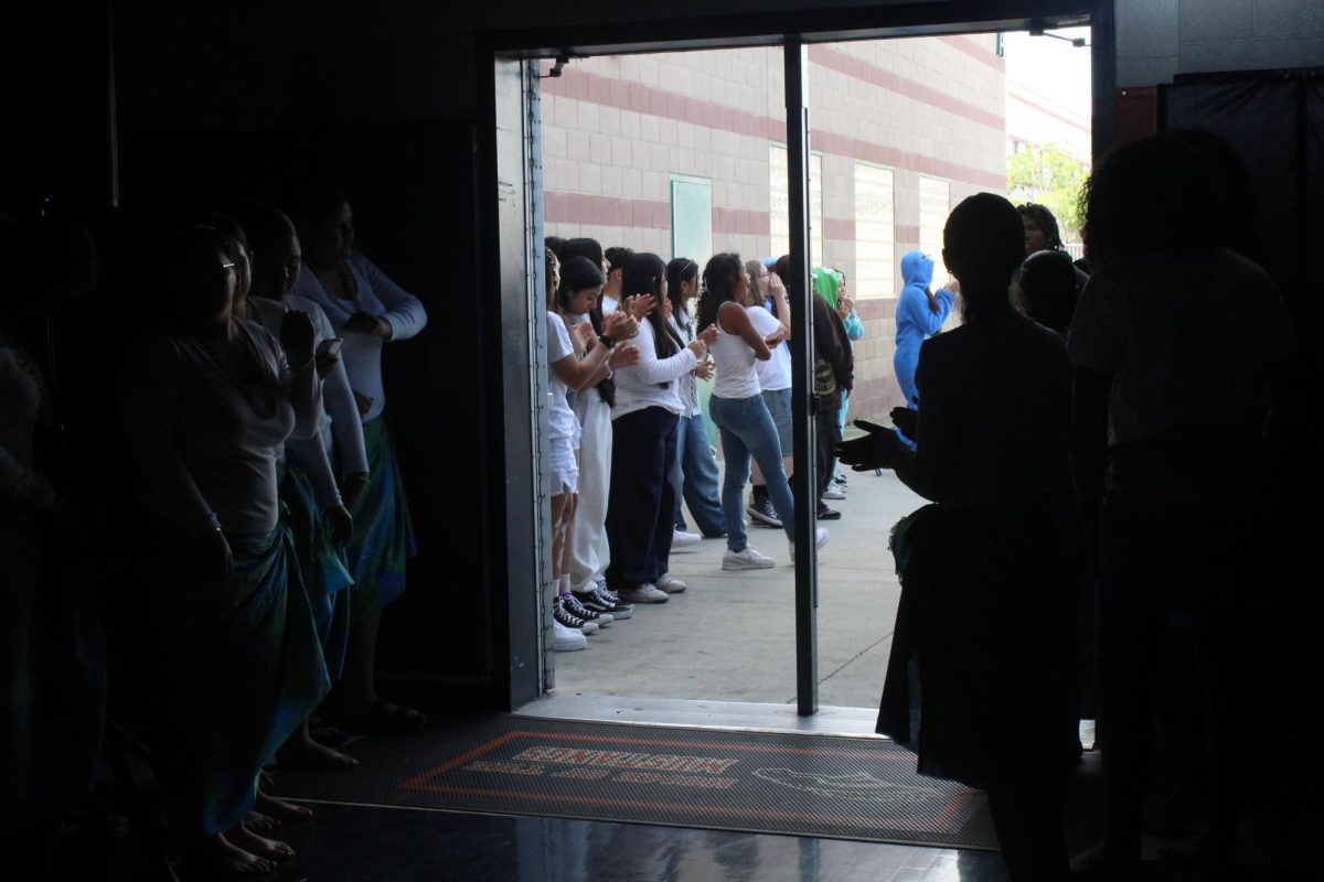 Students entering the gym for the pep rally