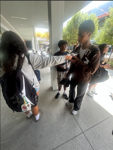  Ally collecting money in exchange for her backed goods. 