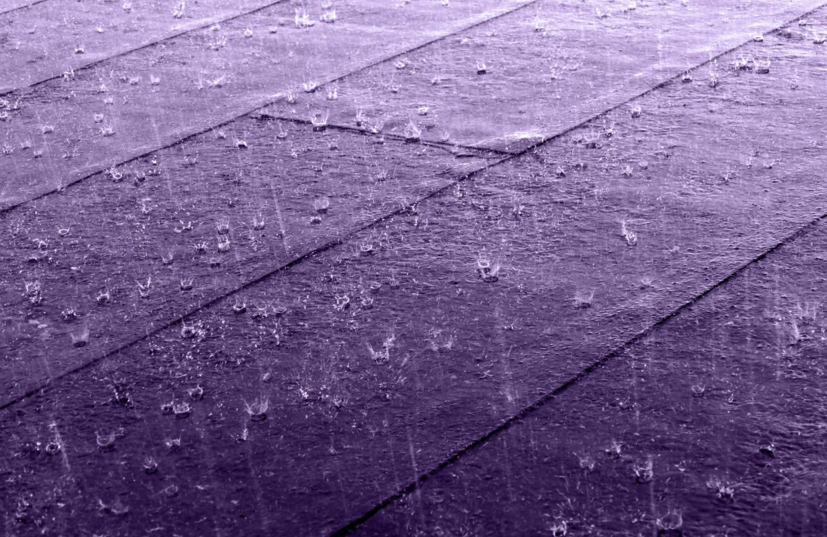 Rain pouring down on the roof. 