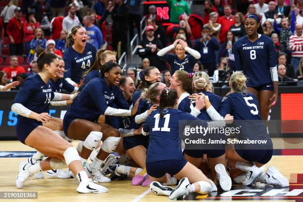 The Penn State Nittany Lions celebrate after defeating the Nebraska Huskers in the Division I Women's Volleyball Semifinals. 
