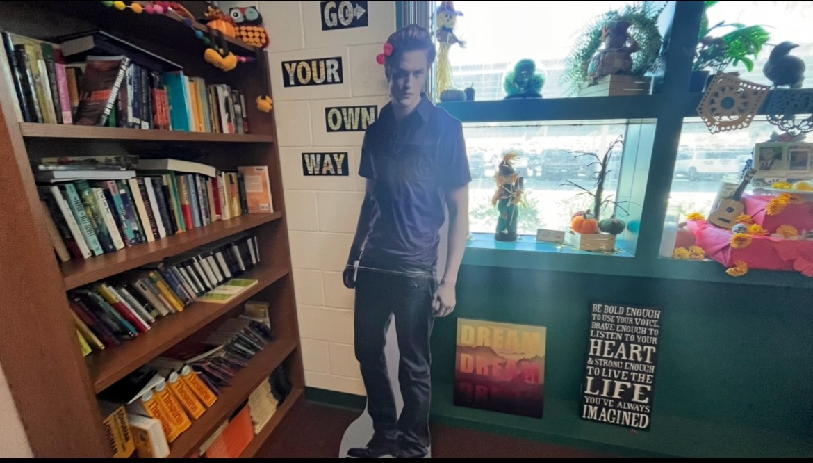 The cardboard cut-out of Eward in E103. 