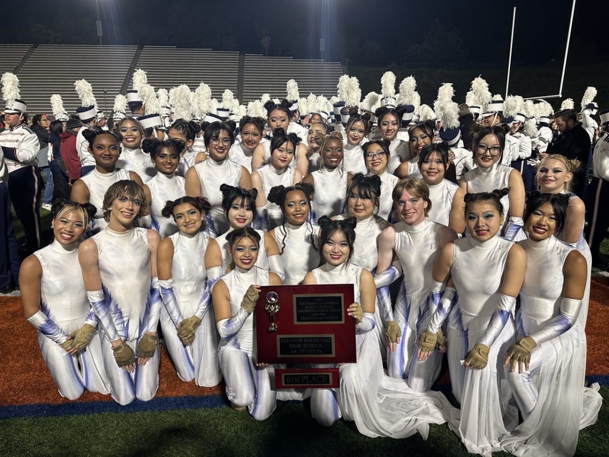 Group photo of color guard at marching band championships 